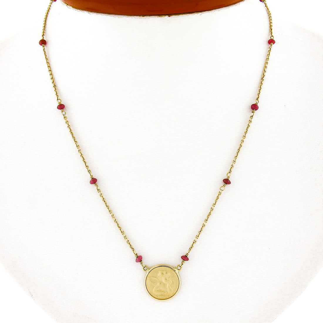 14k Gold Cable Chain Necklace with 18k Cherub Angel Pendant and Ruby Beads: 14k Gold Cable Chain Necklace with 18k Cherub Angel Pendant and Ruby Beads This exquisite necklace features a stunning 16.5-inch chain crafted from solid 14k yellow gold, adorned with twelve natural g