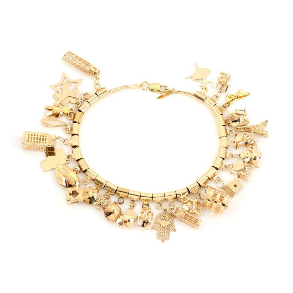 28 Charm 14k Yellow Gold Woven Link Bracelet with Lobster Clasp: 28 Charm 14k Yellow Gold Woven Link Bracelet with Lobster Clasp This exquisite bracelet features a unique design with 28 assorted charms crafted from 14k yellow gold. The charms, which represent iconi