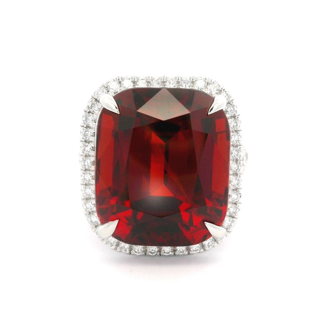 Platinum GIA Certified 22.91ct Spessartine Garnet Diamond Ring: Platinum GIA Certified 22.91ct Spessartine Garnet Diamond Ring This exquisite cocktail ring showcases a mesmerizing natural genuine Spessartine garnet, featuring a cushion brilliant cut and an incredi