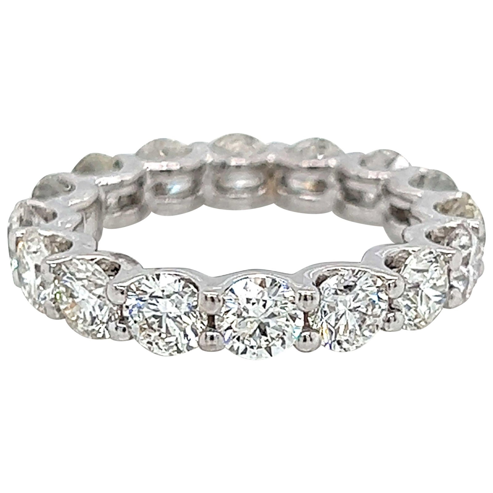 4.25ct Round Diamond Eternity Band Platinum Size 5.5: 4.25ct Round Diamond Eternity Band Platinum Size 5.5 This stunning 4.25 ct Round Diamond Eternity Band is crafted from luxurious platinum and designed in a contemporary style. The ring features 16 rou