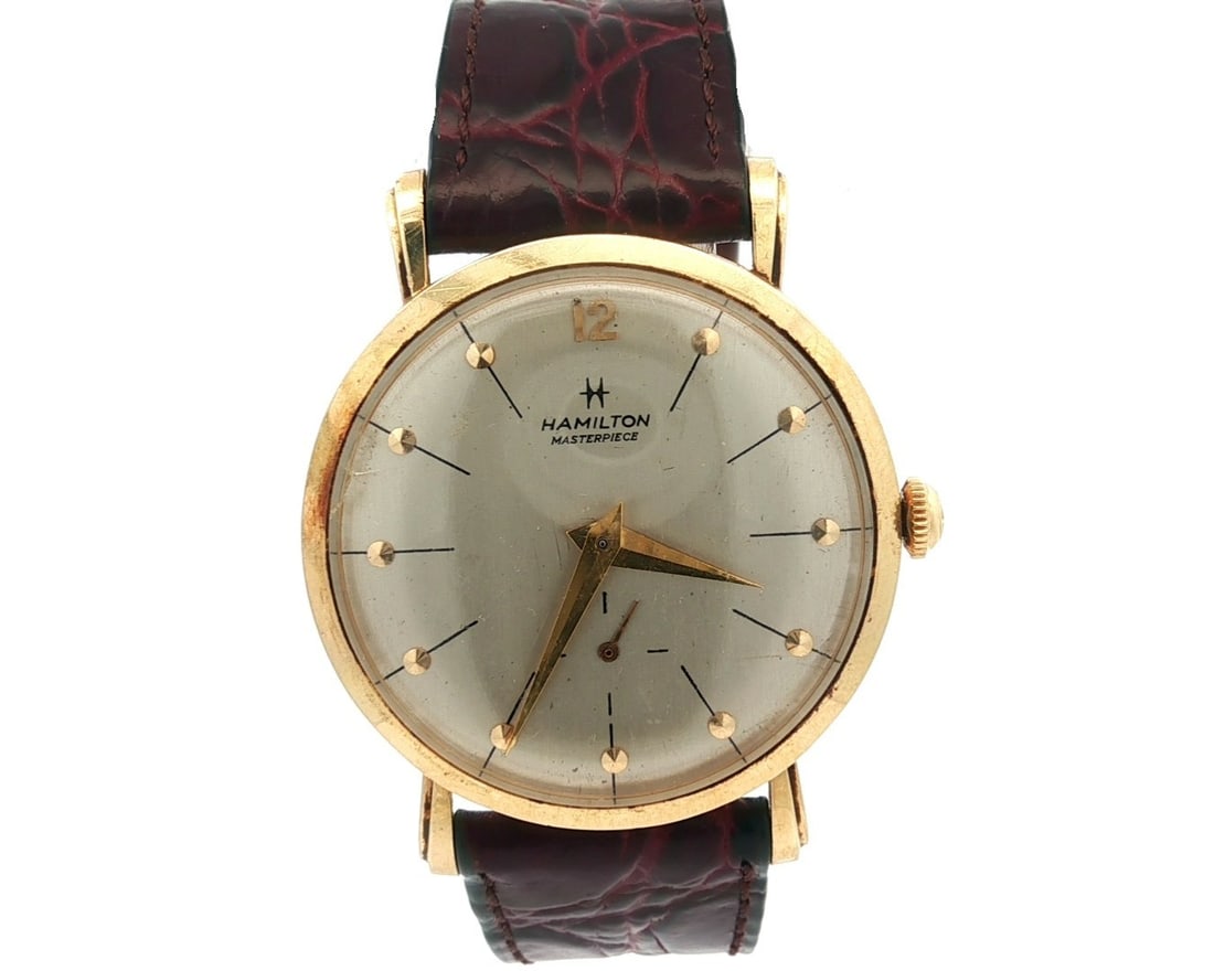 Hamilton Masterpiece 14k Yellow Gold 32mm Mechanical Wristwatch: Hamilton Masterpiece 14k Yellow Gold 32mm Mechanical Wristwatch This Vintage Hamilton Masterpiece wristwatch showcases a stunning 14k yellow gold case with a classic round shape and a 32mm size, perfe
