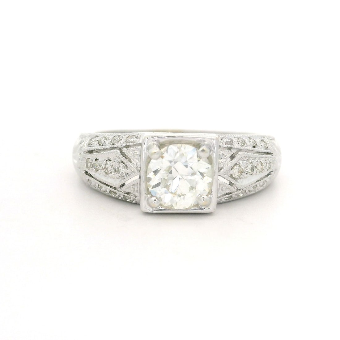 Vintage 14k White Gold 1.15ctw Round Diamond Engagement Ring: Vintage 14k White Gold 1.15ctw Round Diamond Engagement Ring This exquisite vintage style engagement ring features a stunning combination of natural diamonds intricately set in solid 14k white gold. T