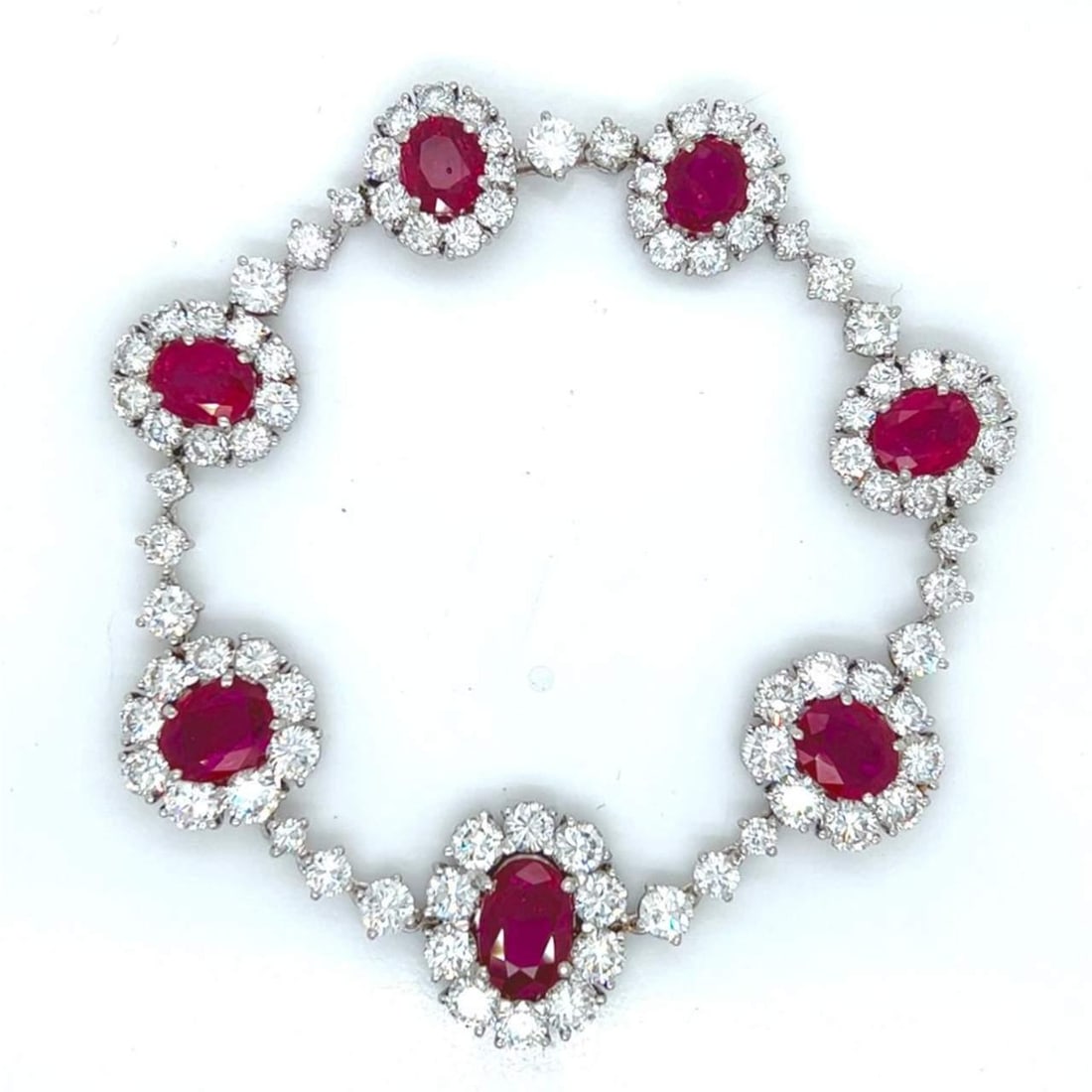 Platinum Thai Ruby Diamond Bracelet SSEF Certified 12.00 Ct Rubies 12.30 Ct Diamonds: Platinum Thai Ruby Diamond Bracelet SSEF Certified 12.00 Ct Rubies 12.30 Ct Diamonds This exquisite Platinum SSEF Certified Thai Ruby & Diamond Bracelet features a stunning array of gemstones. Weighin