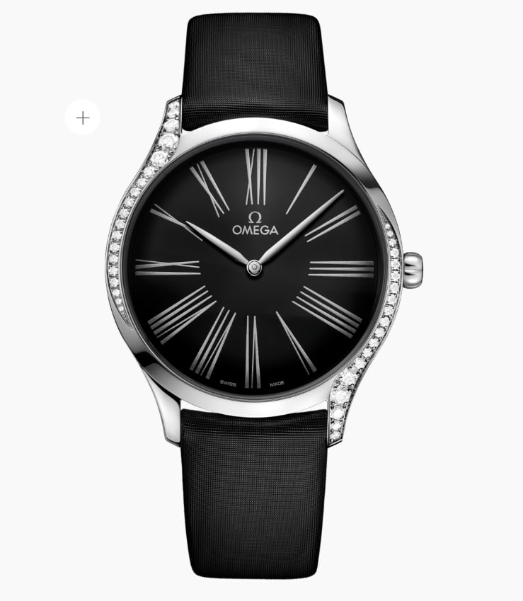 Omega De Ville Tresor Black Dial Fabric Strap Watch with Card Ref 428.17.39.60.01.001: Omega De Ville Tresor Black Dial Fabric Strap Watch with Card Ref 428.17.39.60.01.001 This Omega De Ville Tresor wristwatch features a black dial set within a smooth bezel adorned with diamonds. The w