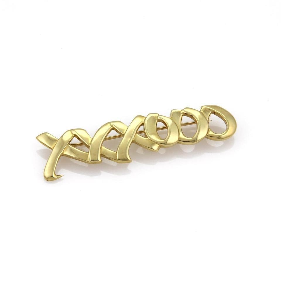 Tiffany Co Paloma Picasso Hugs and Kisses 18k Gold Brooch Pin: Tiffany Co Paloma Picasso Hugs and Kisses 18k Gold Brooch Pin This exquisite brooch pin, crafted by Tiffany & Co. under the artistic vision of Paloma Picasso, features a stunning design from the renow