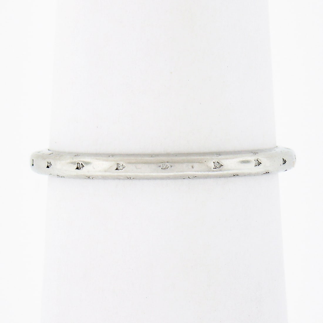 Orange Blossom Platinum Art Deco Engraved Band Ring 1.8mm: Orange Blossom Platinum Art Deco Engraved Band Ring 1.8mm This antique Art Deco wedding band ring by Orange Blossom is crafted from solid .900 platinum. The band features a hand-engraved textured flor