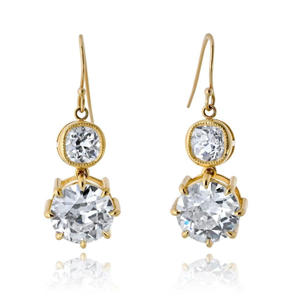 Old European Cut Diamond Drop Earrings 18K Yellow Gold 10.06cttw: Old European Cut Diamond Drop Earrings 18K Yellow Gold 10.06cttw These elegant drop earrings are crafted from 18K yellow gold and showcase a total of 10.06 carats of certified diamonds. Each earring f