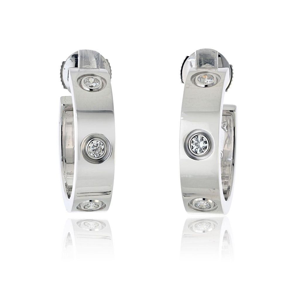 Love Collection Earrings in 18K White Gold by Cartier: Love Collection Earrings in 18K White Gold by Cartier These pre-owned Cartier Love earrings feature the iconic Love design and are crafted from 18K white gold. A timeless and elegant accessory, they a
