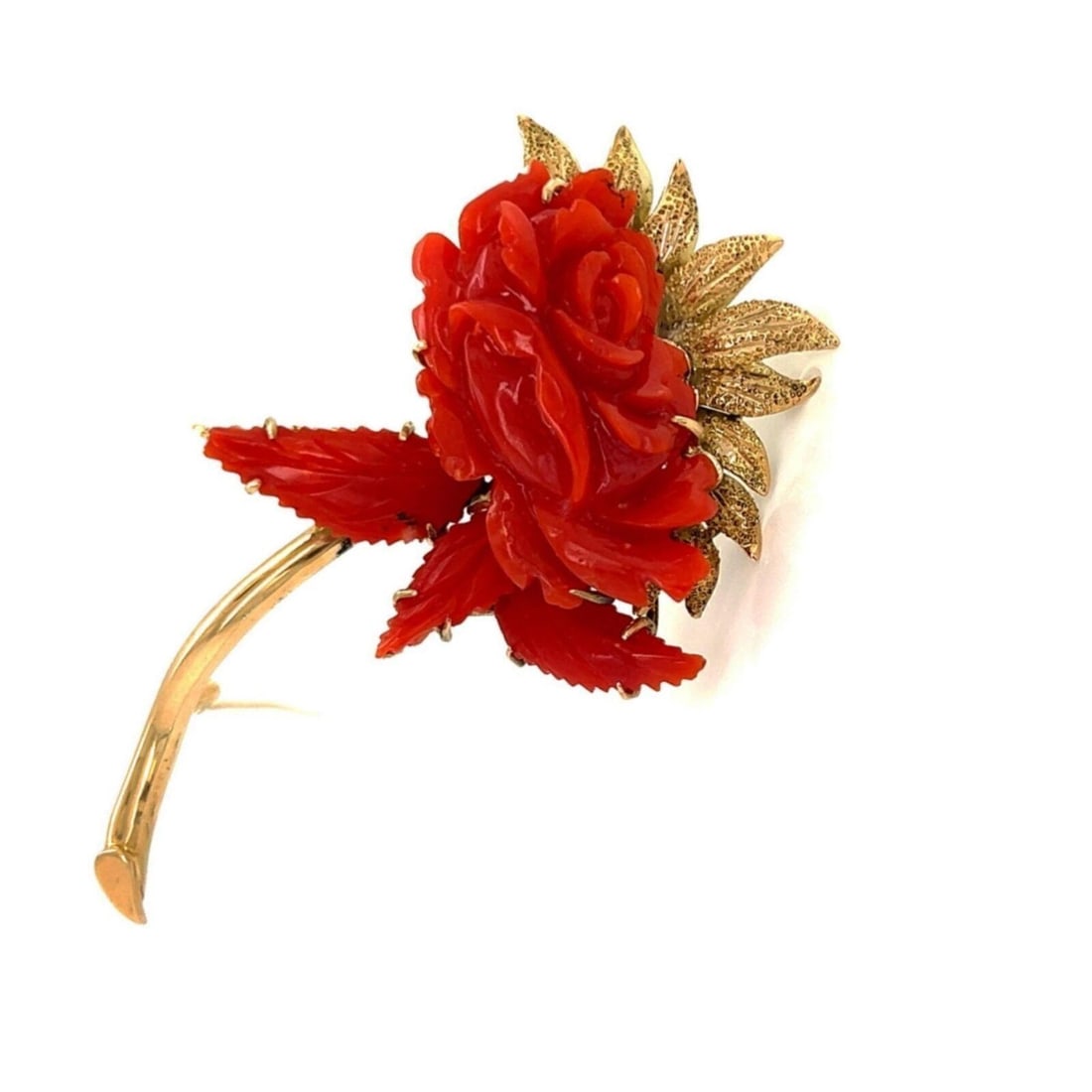 Vintage 18k Yellow Gold Floral Stem Brooch with Carved Coral: Vintage 18k Yellow Gold Floral Stem Brooch with Carved Coral This vintage estate brooch is crafted in 18k yellow gold and features a carved coral floral stem design. The piece has a sculptural, elonga