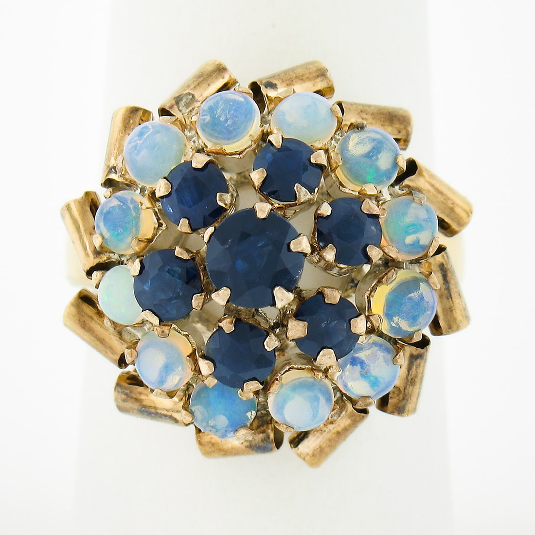 Vintage Antique 8K Yellow Gold Sapphire Opal Cocktail Ring Cluster Design: Vintage Antique 8K Yellow Gold Sapphire Opal Cocktail Ring Cluster Design This exquisite antique cocktail ring showcases a stunning combination of 8K solid yellow gold, set with a vibrant cluster of n