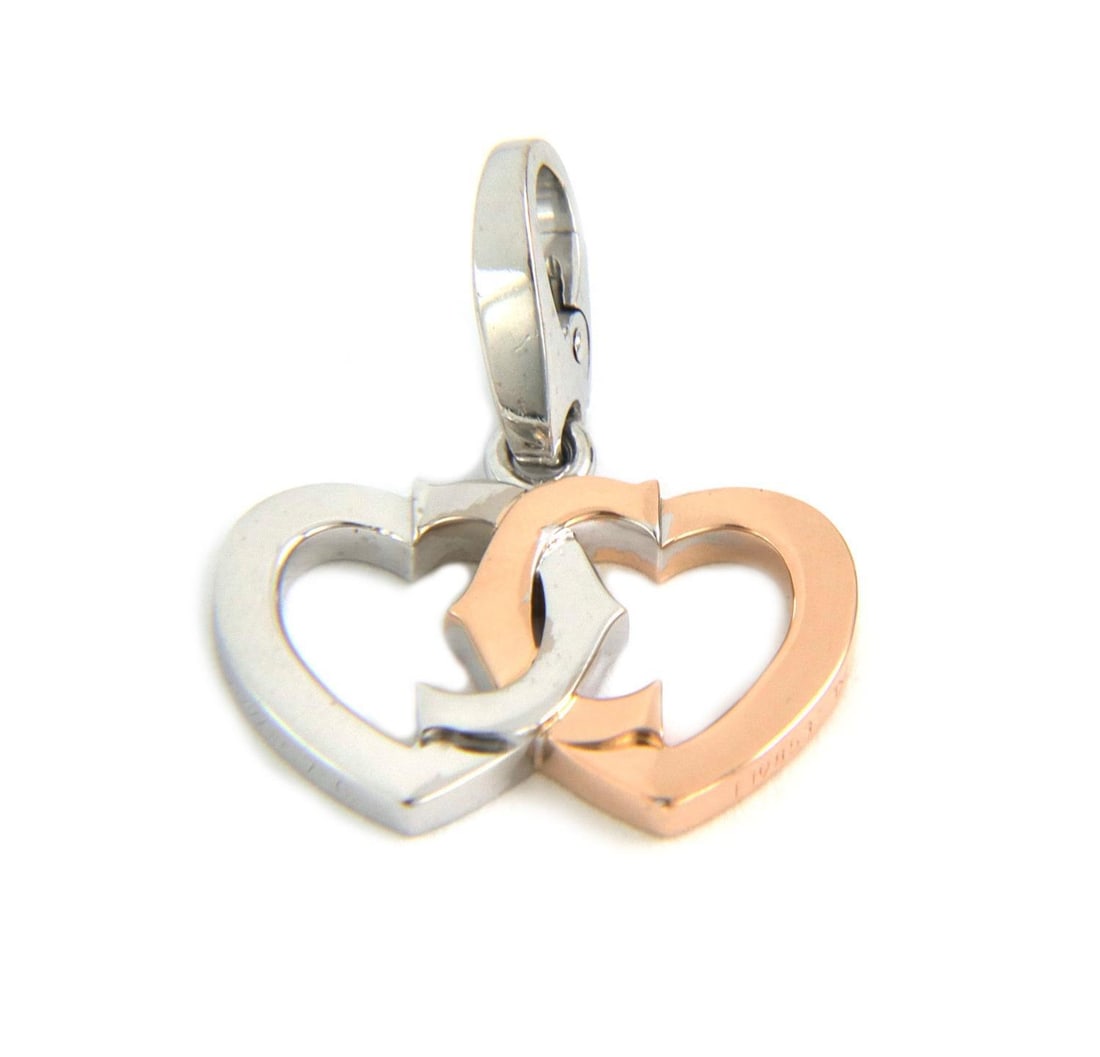 Cartier Double C 18k White Pink Gold Interlaced Hearts Pendant: Cartier Double C 18k White Pink Gold Interlaced Hearts Pendant This exquisite authentic pendant from Cartier's Double C collection features a stunning design of two interlaced hearts. Crafted from 18k