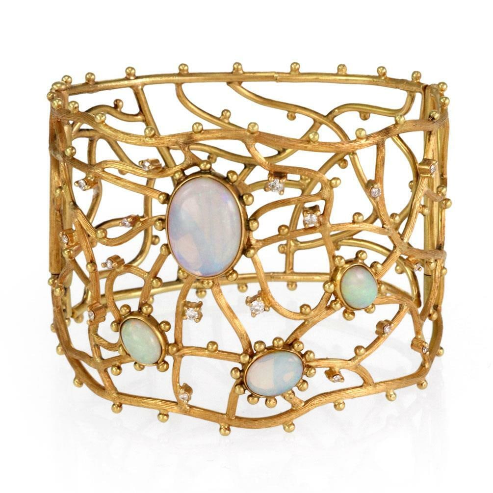 Estate 6.20ct Opal Diamond 18k Yellow Gold Wide Bracelet: Estate 6.20ct Opal Diamond 18k Yellow Gold Wide Bracelet This stunning estate bracelet is masterfully crafted from 18k yellow gold, showcasing a unique textured open branch-like design. The front half