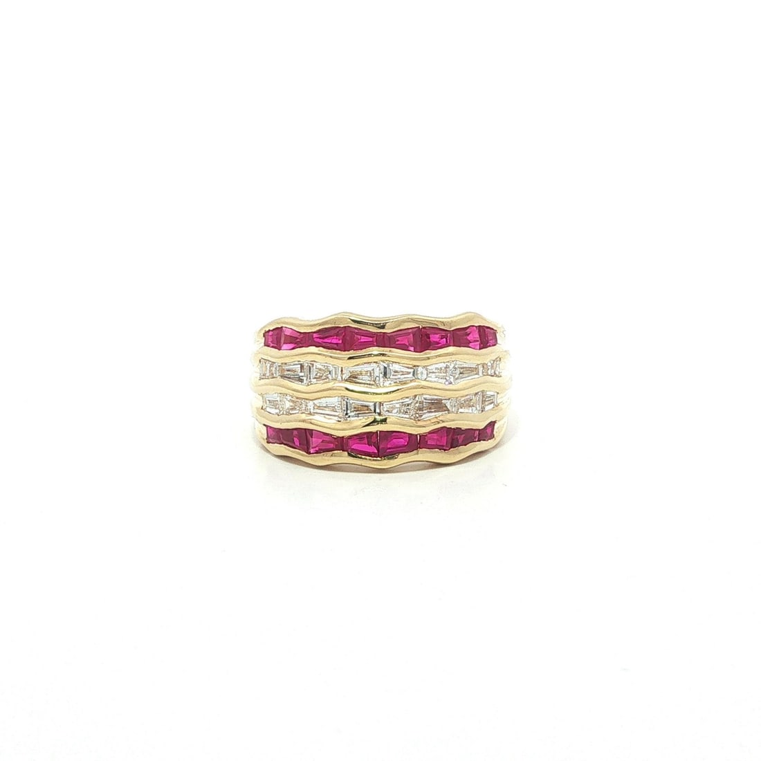 Wide Wavy Band Ring in 18k Gold with Baguette Rubies and Diamonds: Wide Wavy Band Ring in 18k Gold with Baguette Rubies and Diamonds This elegant band ring features four rows of baguette-cut natural rubies and diamonds set in solid 18k yellow gold. The ring showcases