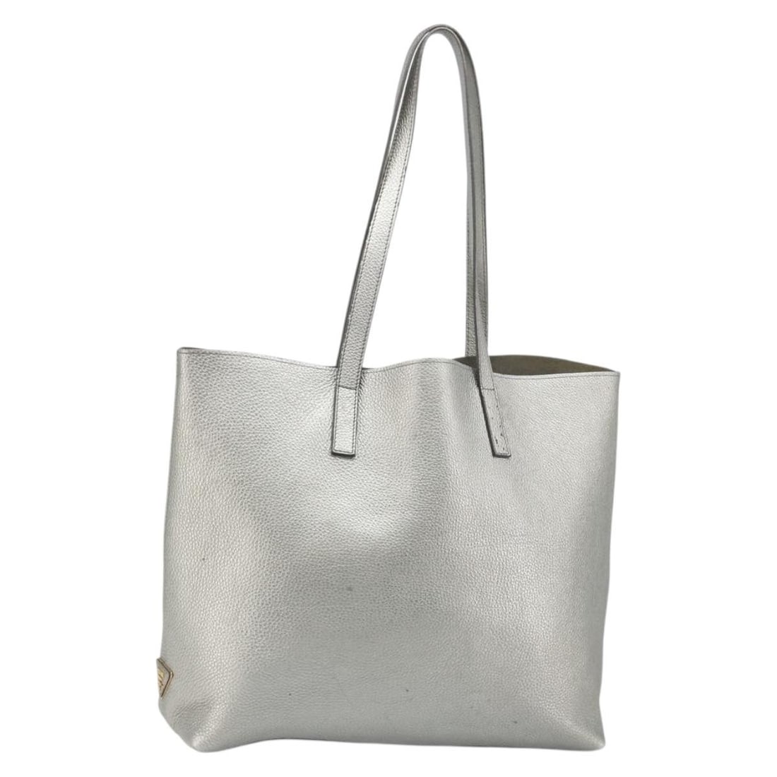 PRADA Silver Leather Womens Tote Handbag Made in Italy: PRADA Silver Leather Womens Tote Handbag Made in Italy Prada tote bag in silver leather with a spacious everyday silhouette and shoulder-length handles. Made in Italy, this women's bag is offered as t