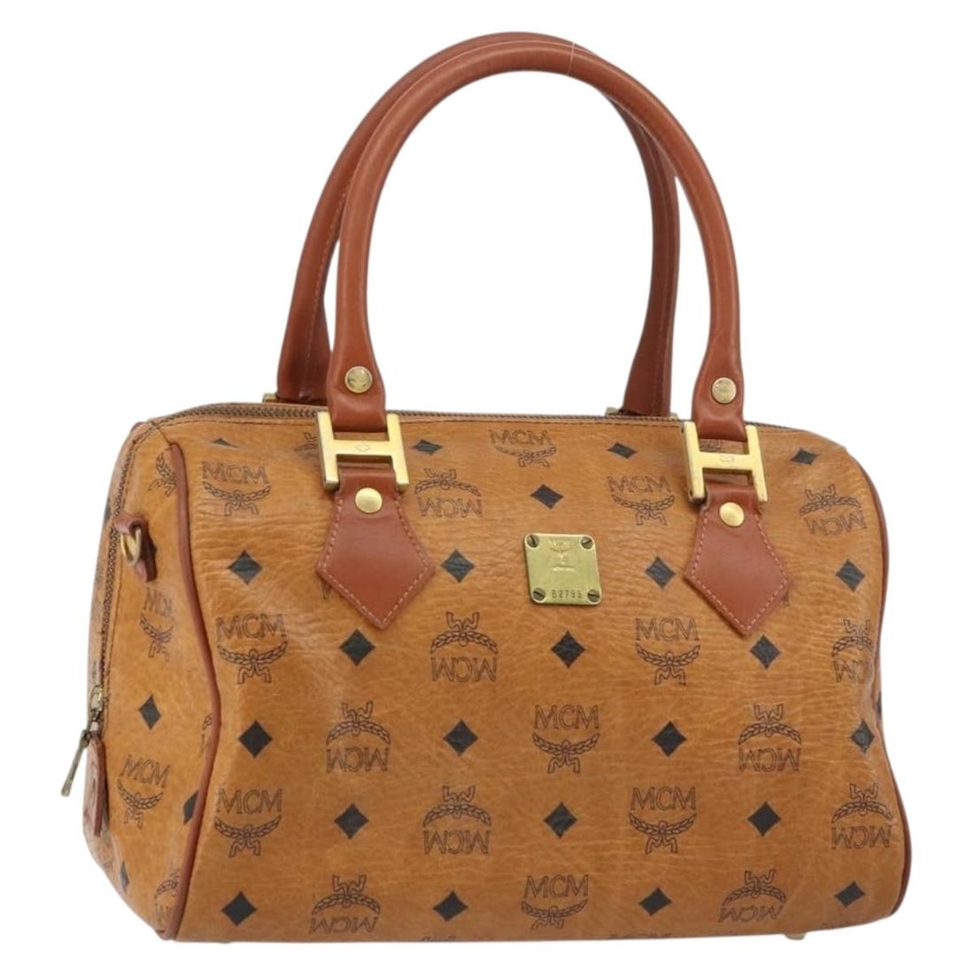 Brown Gold MCM Vicetos Logogram PVC Leather Handbag: Brown Gold MCM Vicetos Logogram PVC Leather Handbag This MCM Vicetos Logogram hand bag features brown and gold PVC leather with signature branding. The bag includes a structured silhouette with dual h