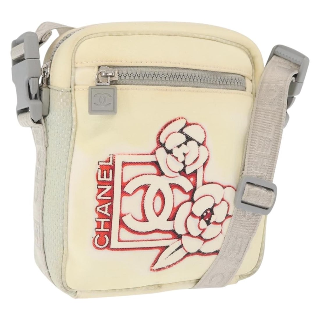 CHANEL Sports Line White Nylon Shoulder Bag with Silver CC Logo: CHANEL Sports Line White Nylon Shoulder Bag with Silver CC Logo This CHANEL Sports Line shoulder bag features a white and silver nylon exterior with the iconic CC logo. Designed for women, the bag inc