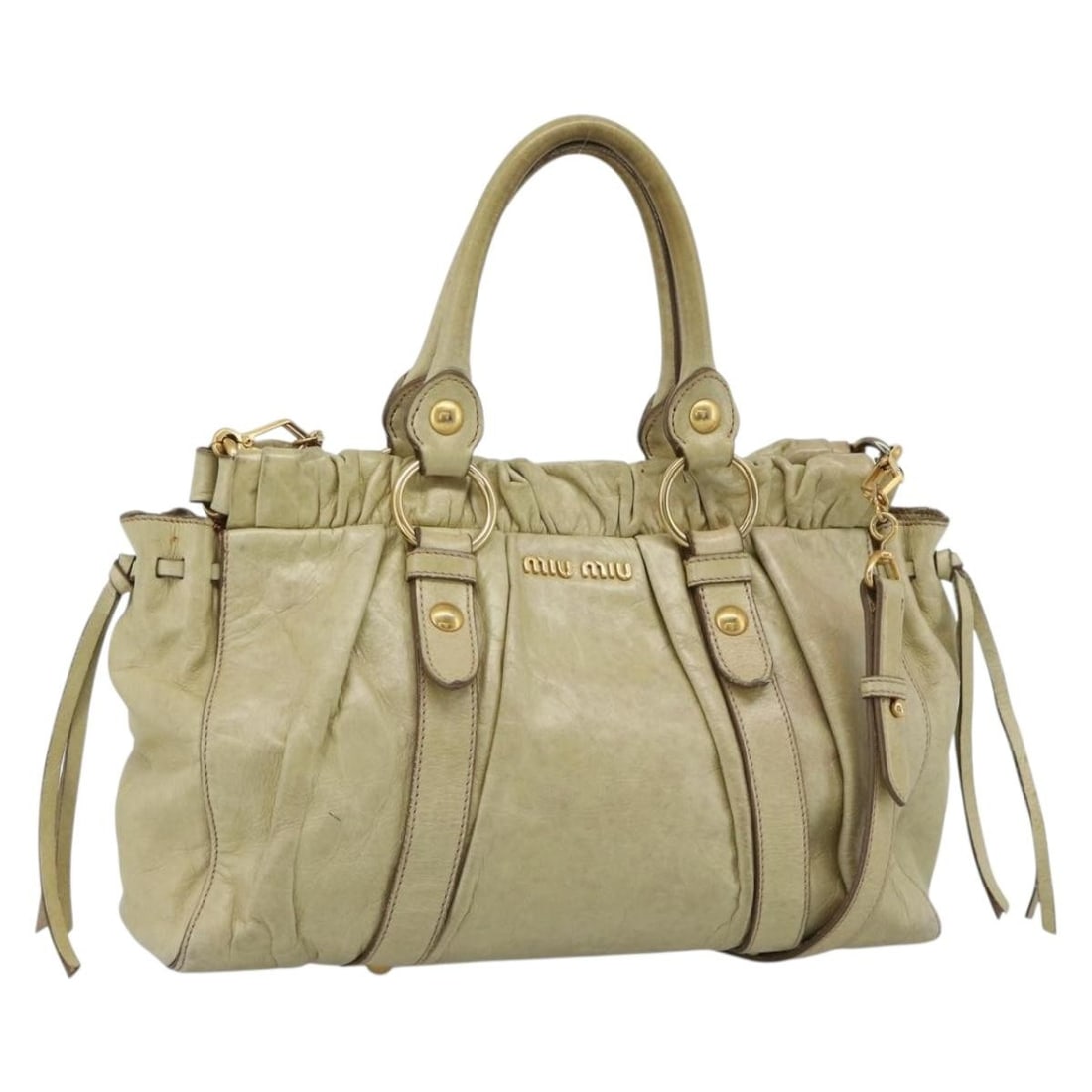 Miu Miu Matelasse Leather 2way Handbag Beige with Shoulder Strap: Miu Miu Matelasse Leather 2way Handbag Beige with Shoulder Strap Miu Miu matelasse leather hand bag in beige and gold, featuring a 2-way design and a shoulder strap accessory. Made in Turkey, this wom