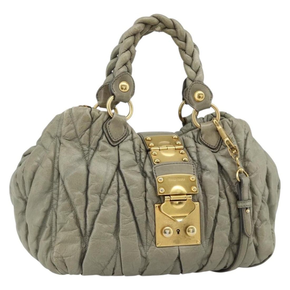 Miu Miu Matelasse Gray Gold Leather 2way Handbag Ready Lock: Miu Miu Matelasse Gray Gold Leather 2way Handbag Ready Lock This Miu Miu Matelasse Ready Lock handbag features a gray and gold leather exterior with a two-way design, allowing it to be carried by hand