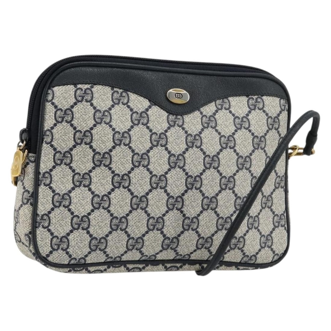 Gucci 97 02 068 GG Supreme PVC Leather Shoulder Bag Navy Gold: Gucci 97 02 068 GG Supreme PVC Leather Shoulder Bag Navy Gold Authentic Gucci GG Supreme shoulder bag in navy and gold with PVC leather and GG canvas construction. This women's shoulder bag is made in