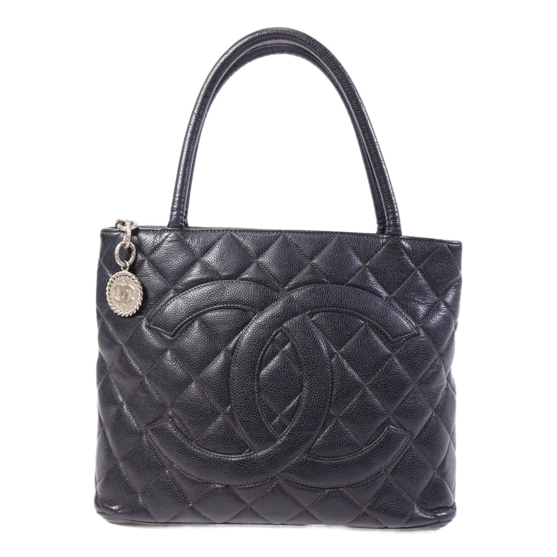 Vintage Calfskin Handbag Black Chanel CC with SHW: Vintage Calfskin Handbag Black Chanel CC with SHW Vintage CHANEL CC SHW hand bag in black calfskin (cowhide) leather. The bag features a black-on-black colorway, handle drop of 41 cm, and multiple poc