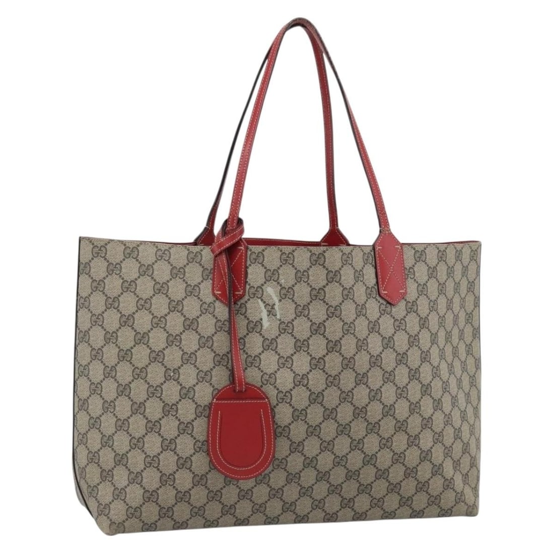Gucci GG Supreme PVC Tote Beige with Name Tag: Gucci GG Supreme PVC Tote Beige with Name Tag Beige Gucci GG Supreme tote bag in PVC leather/GG canvas, made in Italy. It includes a name tag accessory and shows heavy use with visible rubbing, stains