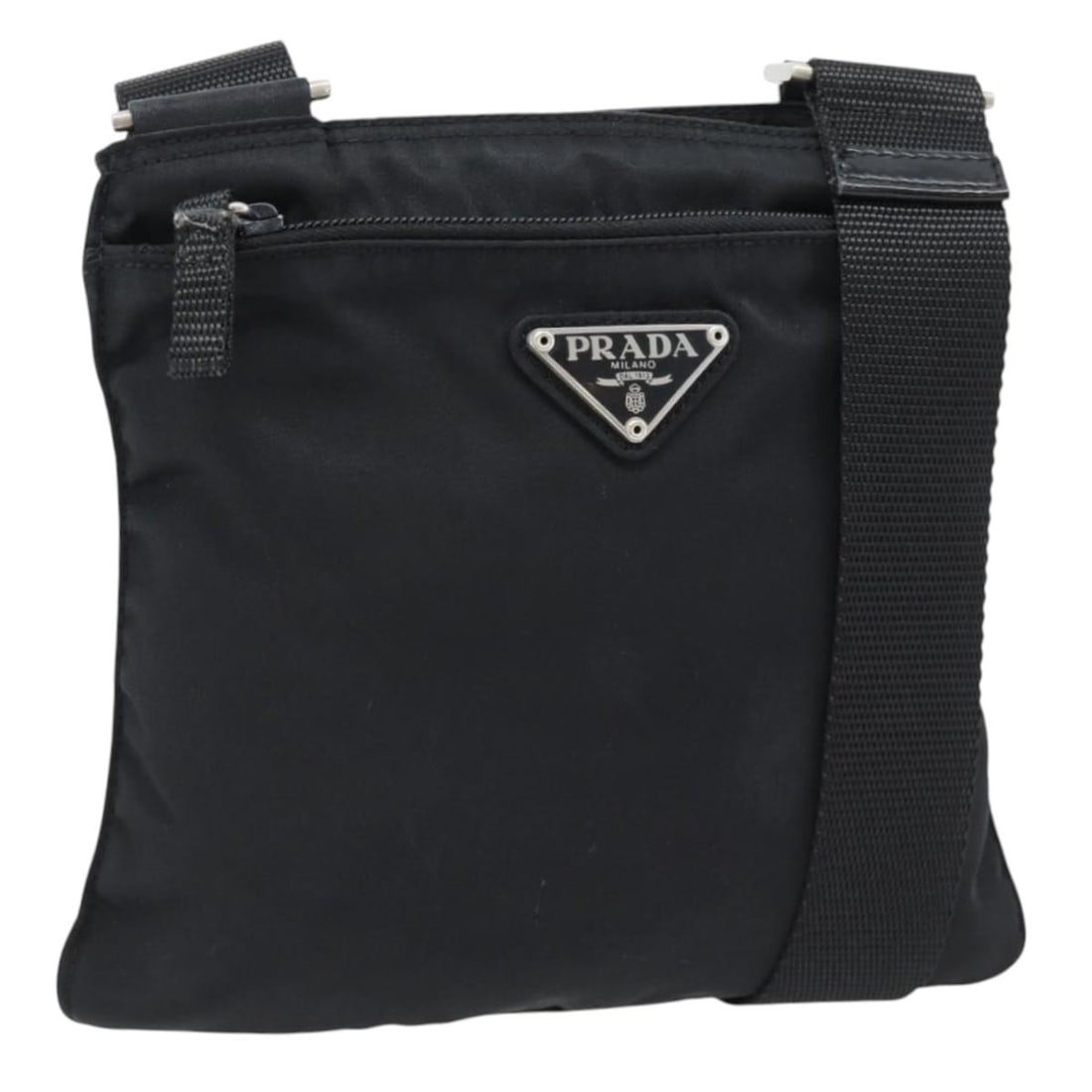 PRADA black nylon shoulder bag silver tone hardware Italy: PRADA black nylon shoulder bag silver tone hardware Italy Prada shoulder bag in black nylon with silver-tone accents. Made in Italy, this women's bag features an adjustable shoulder strap and a compac