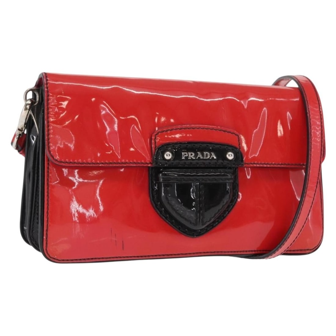 PRADA Red Silver Enamel 2 Way Shoulder Bag Made in Italy: PRADA Red Silver Enamel 2 Way Shoulder Bag Made in Italy A PRADA 2-way shoulder bag in red and silver enamel, made in Italy. It features a shoulder strap and handle, and the listing states that only t