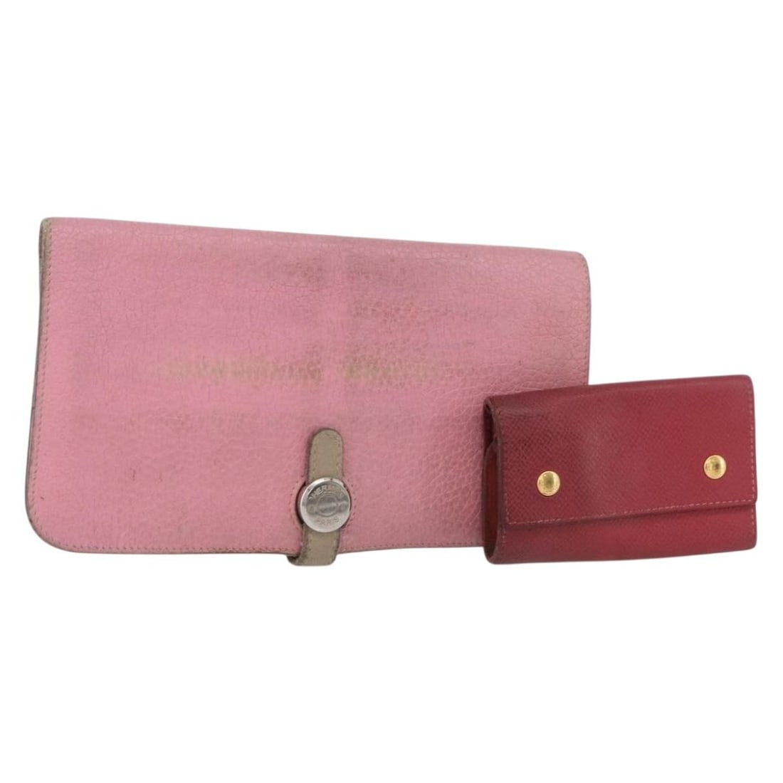 Set of 2 Hermes Leather Wallets in Red and Pink: Set of 2 Hermes Leather Wallets in Red and Pink This is a set of two Hermes wallets crafted from leather in red and pink colors. Designed for women, both wallets are made in France. The set does not i