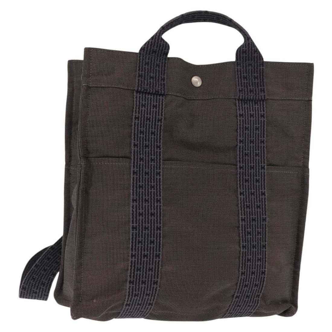 HERMES Her Line Gray Silver Canvas Backpack Authentic: HERMES Her Line Gray Silver Canvas Backpack Authentic This authentic HERMES Her Line Backpack is crafted from durable canvas in a sophisticated gray and silver color combination. Made in France, this 