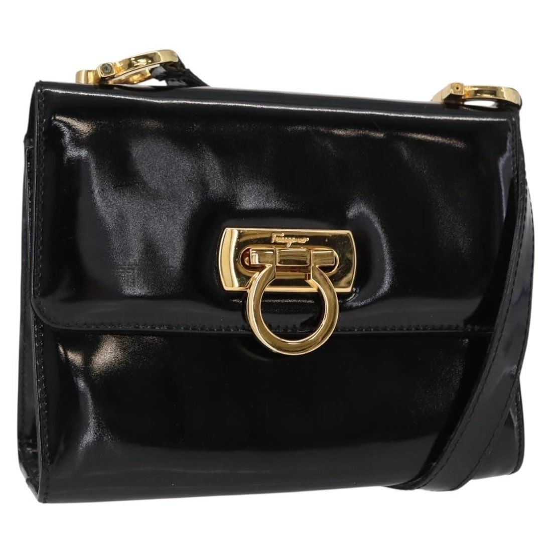 Salvatore Ferragamo Gancini Enamel Shoulder Bag Black Gold Authentic: Salvatore Ferragamo Gancini Enamel Shoulder Bag Black Gold Authentic This stylish Salvatore Ferragamo Gancini Shoulder Bag showcases a chic blend of black and gold enamel, perfect for adding a touch o