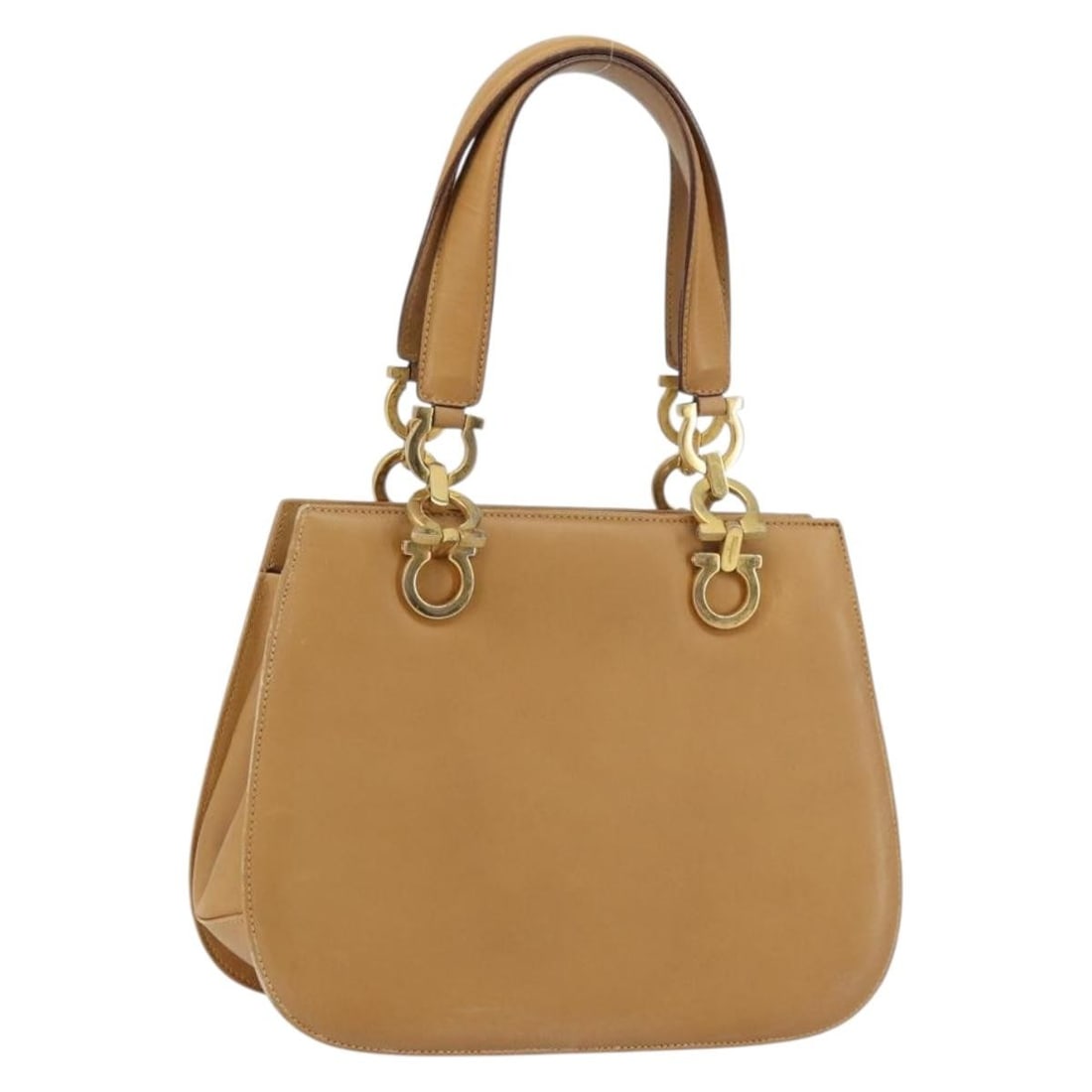 Ferragamo Gancini beige leather handbag gold tone Italy: Ferragamo Gancini beige leather handbag gold tone Italy This Salvatore Ferragamo Gancini hand bag features a beige and gold leather exterior with gold-tone accents. Designed for women, it offers a str