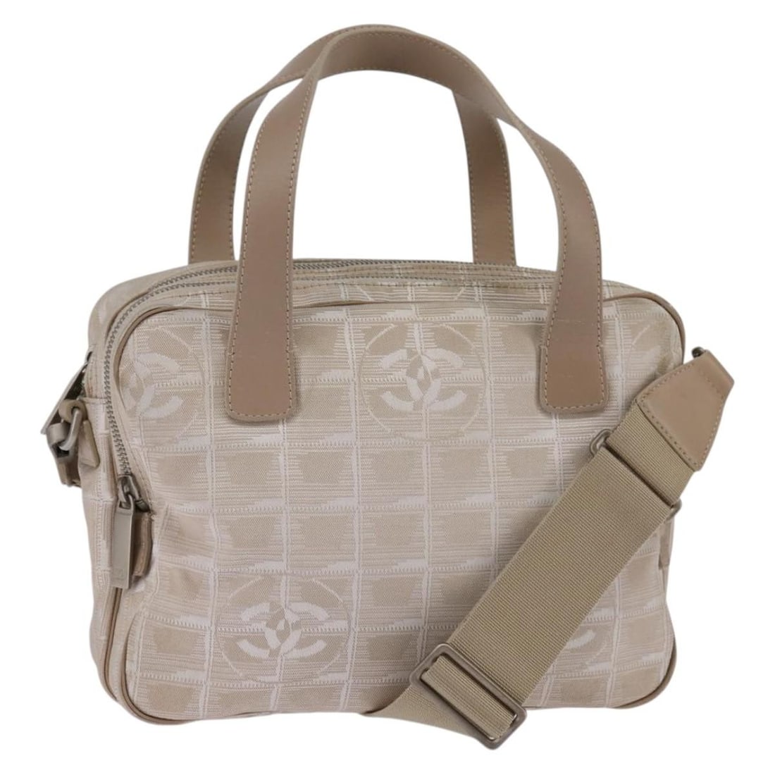 CHANEL New Travel Line Nylon 2way Hand Bag Beige Silver Strap Card: CHANEL New Travel Line Nylon 2way Hand Bag Beige Silver Strap Card This CHANEL New Travel Line handbag is made of nylon in a beige and silver color combination. It is a 2-way hand bag style and comes 
