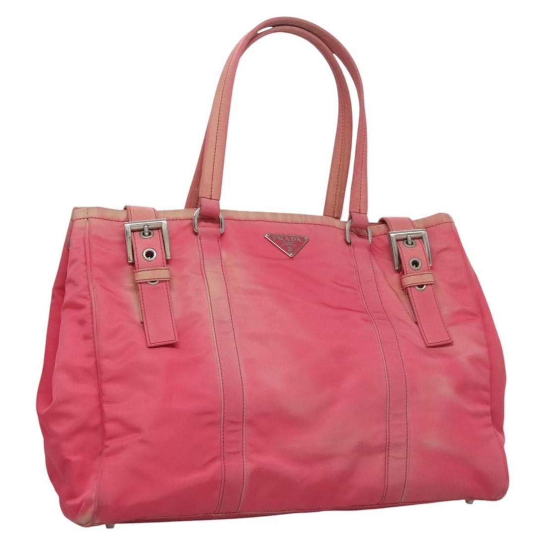 Pink Nylon Prada Tote Bag for Women Made in Italy: Pink Nylon Prada Tote Bag for Women Made in Italy This authentic PRADA tote bag features a pink nylon exterior and is designed for women. The bag is heavily used, with visible signs of wear including 