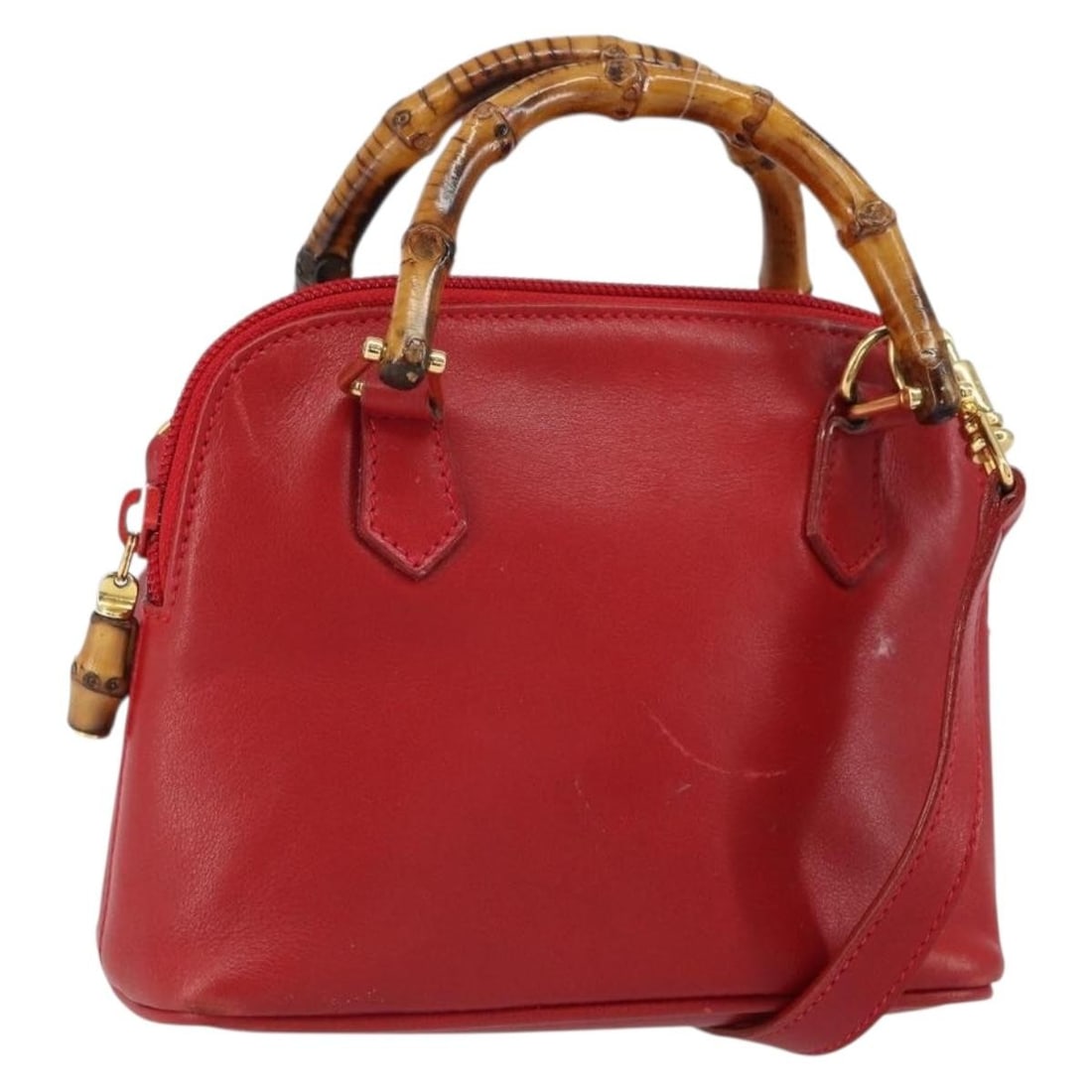 Gucci Bamboo leather red gold handbag with shoulder strap: Gucci Bamboo leather red gold handbag with shoulder strap This GUCCI Bamboo Hand Bag is crafted from red and gold leather and offers both hand and shoulder carry options with its detachable shoulder s