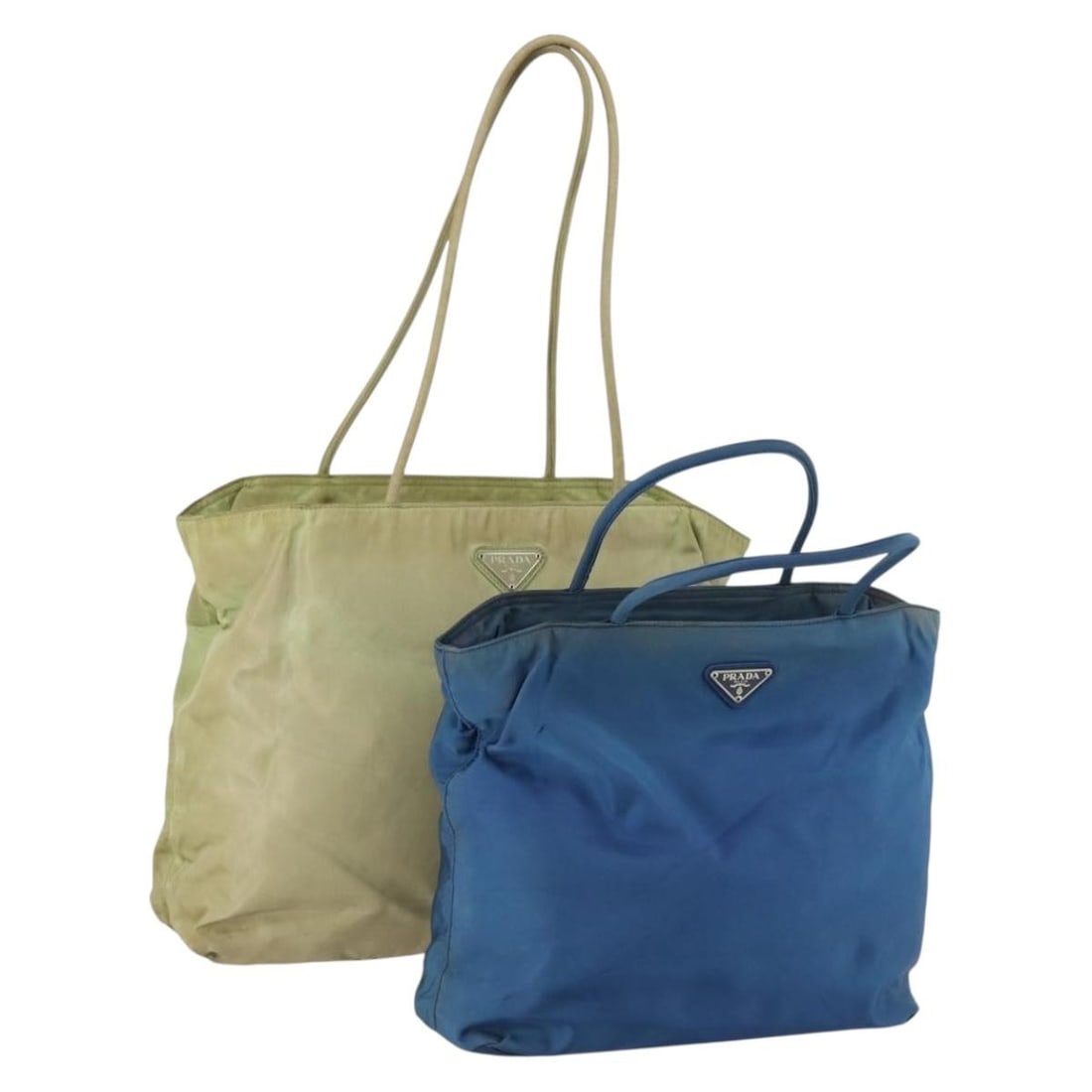 PRADA Nylon Blue Beige Tote Bag Set of 2: PRADA Nylon Blue Beige Tote Bag Set of 2 This PRADA tote bag set includes two nylon bags in blue and beige tones, designed for women. Made in Italy, these bags feature a practical tote style with a sp