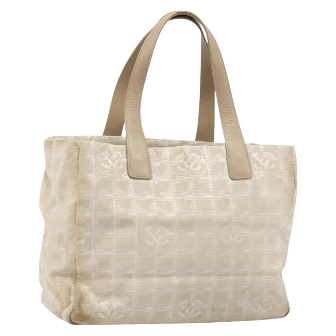 Chanel Beige Nylon New Travel Line Women's Tote Bag Gold CC Italy: Chanel Beige Nylon New Travel Line Women's Tote Bag Gold CC Italy This CHANEL Travel Line tote bag is crafted from beige and gold nylon and is designed for women. The bag shows notable signs of use, i