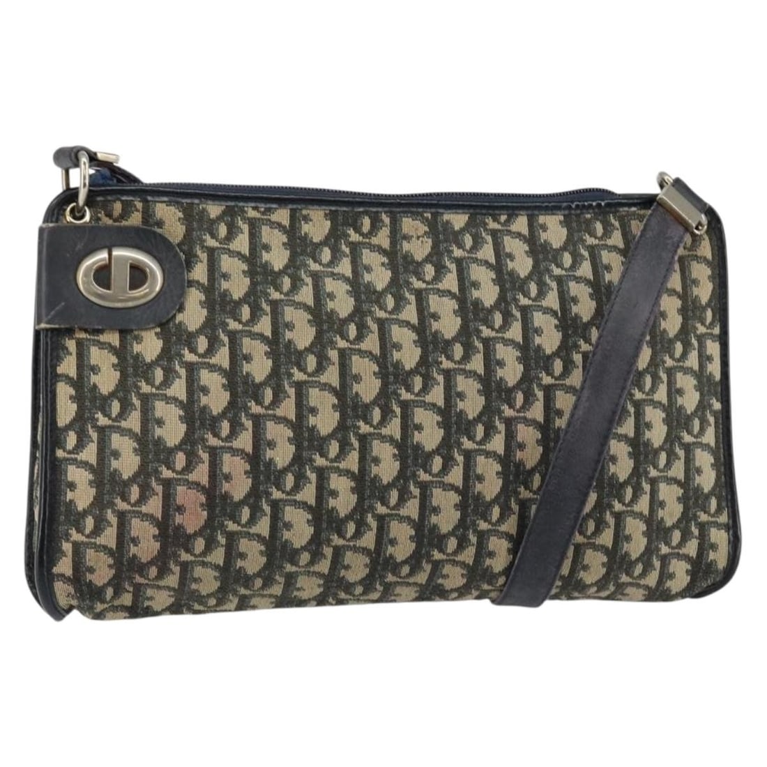 Christian Dior Navy Trotter Canvas Shoulder Purse Gold Accents France: Christian Dior Navy Trotter Canvas Shoulder Purse Gold Accents France This Christian Dior Trotter Canvas Shoulder Bag features a navy and gold color scheme with the iconic Trotter canvas exterior. Des