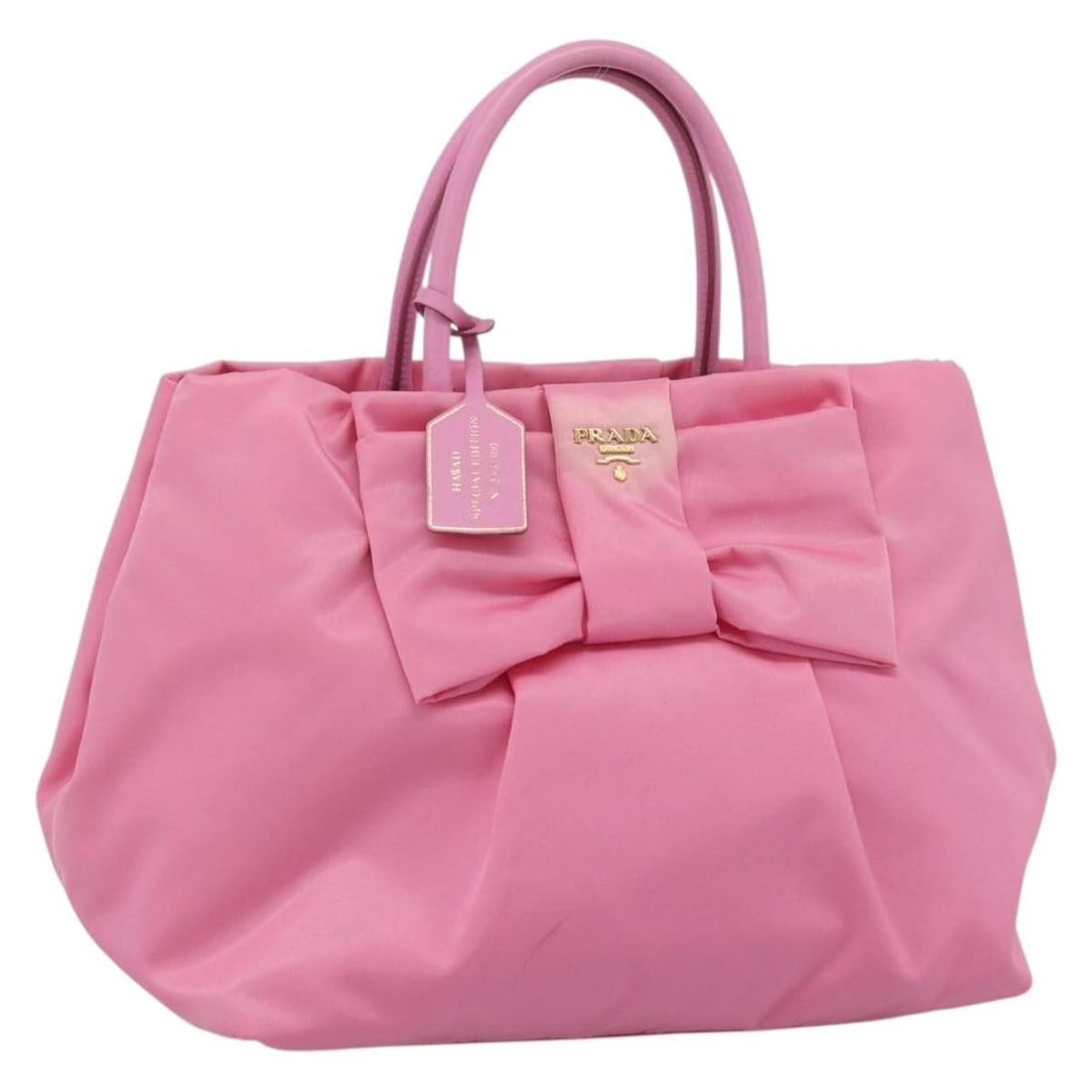 Prada pink nylon handbag with guarantee card Italy: Prada pink nylon handbag with guarantee card Italy This PRADA women's handbag is crafted from pink and gold nylon, offering a stylish and functional accessory. Made in Italy, the bag features a handle