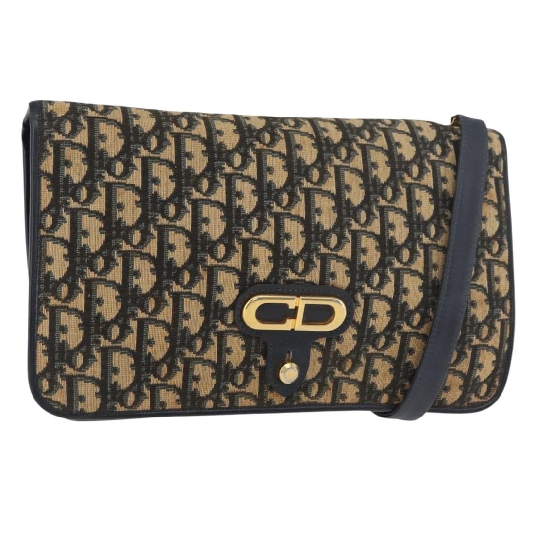 Christian Dior Trotter Shoulder Bag in Navy Gold Canvas: Christian Dior Trotter Shoulder Bag in Navy Gold Canvas A Christian Dior Trotter canvas shoulder bag in navy and gold, made in France. The bag features a shoulder strap and measures approximately W29 