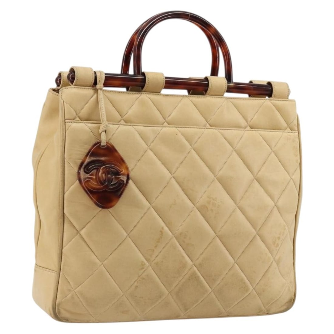 CHANEL CC Beige Lamb Skin Matelasse Handbag: CHANEL CC Beige Lamb Skin Matelasse Handbag Chanel Matelasse hand bag in beige lamb skin. This women's bag is made in Italy and includes only the item shown in the photo; item box and dust bag are not