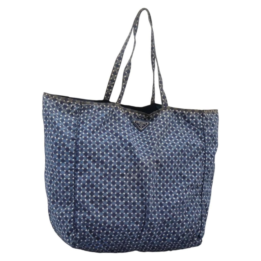 Blue Nylon Tote by PRADA Italy Large Handbag for Women: Blue Nylon Tote by PRADA Italy Large Handbag for Women This PRADA tote bag is crafted from blue nylon and designed for women. Made in Italy, the bag features a spacious interior with a handle drop of 