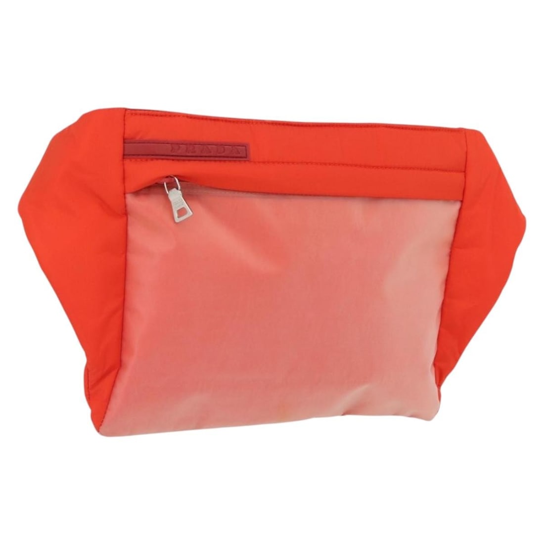Prada orange silver nylon body bag with guarantee card: Prada orange silver nylon body bag with guarantee card This PRADA Sports body bag features a durable nylon construction in a striking orange and silver color combination. Designed for women, it offers