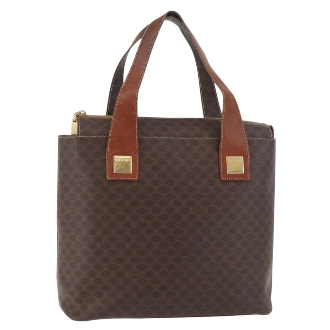 CELINE Macadam Canvas Brown Gold Handbag PVC Leather Italy: CELINE Macadam Canvas Brown Gold Handbag PVC Leather Italy This CELINE Macadam Canvas hand bag features a classic brown and gold color scheme with PVC leather and signature Macadam canvas. Designed fo