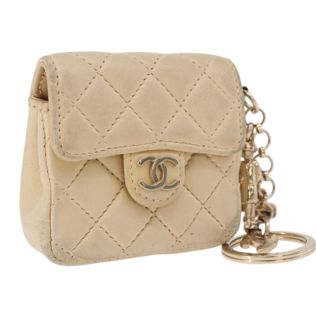CHANEL CC Beige Lamb Skin Mini Charm France: CHANEL CC Beige Lamb Skin Mini Charm France CHANEL Mini Mini Matelasse Charm in beige lamb skin, made in France. This charm measures approximately 7 cm W x 6 cm H x 2.5 cm D (2.8 x 2.4 x 1.0 inches). 