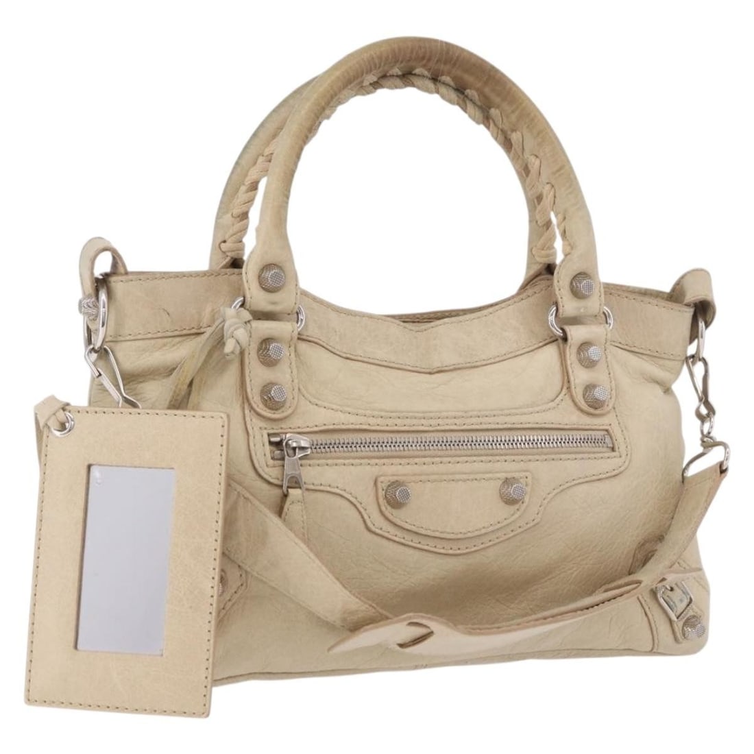 Balenciaga The First Beige Leather 2way Handbag with Strap Mirror: Balenciaga The First Beige Leather 2way Handbag with Strap Mirror Balenciaga The First Hand Bag is a women's leather handbag in beige and silver, made in Italy. It features a shoulder strap and mirror