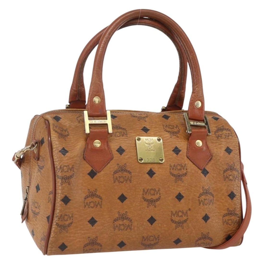 MCM Logogram Vicetos Brown Gold PVC Leather Hand Bag Auth BA8199: MCM Logogram Vicetos Brown Gold PVC Leather Hand Bag Auth BA8199 This MCM Logogram Vicetos Hand Bag is a stylish accessory crafted from PVC leather in a chic brown and gold color combination. Measurin