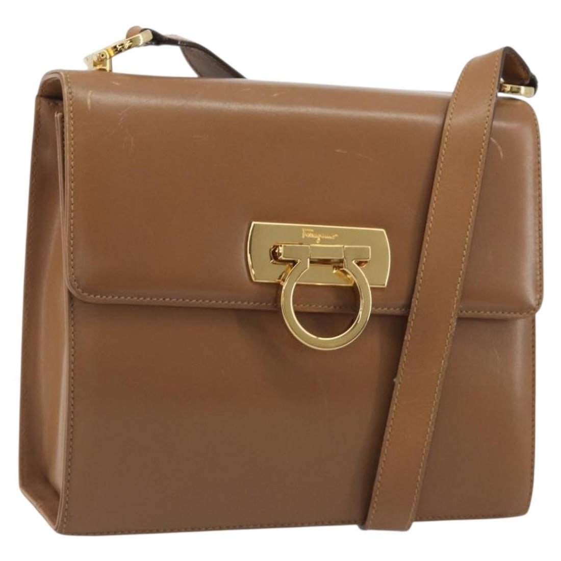 Leather Shoulder Bag Salvatore Ferragamo Gancini Brown Gold Tone: Leather Shoulder Bag Salvatore Ferragamo Gancini Brown Gold Tone A Salvatore Ferragamo Gancini shoulder bag crafted in brown leather with gold-tone hardware. Made in Italy, it features a shoulder stra