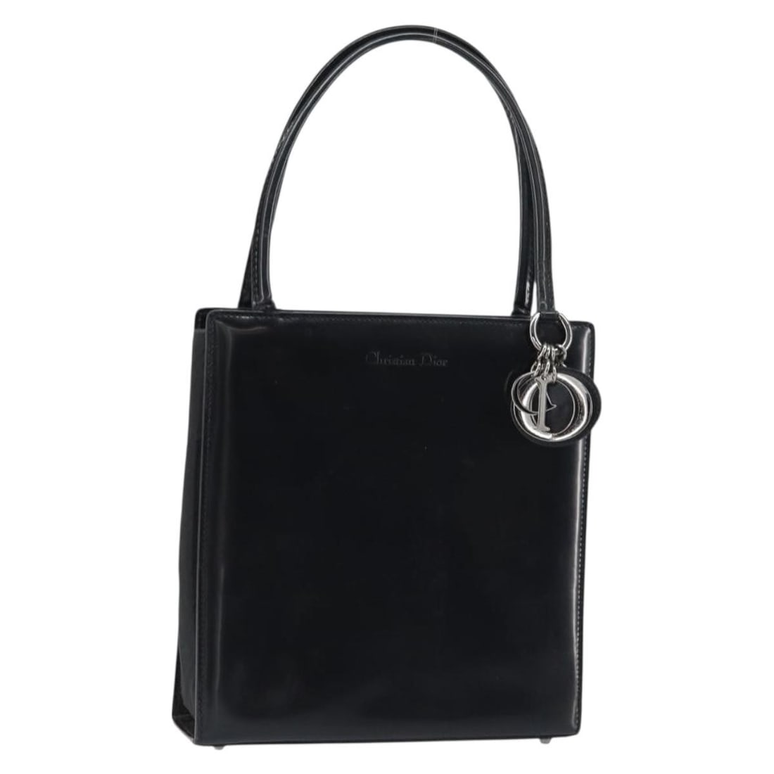 Christian Dior black leather handbag with silver tone charm and guarantee card: Christian Dior black leather handbag with silver tone charm and guarantee card Christian Dior hand bag in black and silver leather, made in Italy. It comes with a guarantee card and charm. The bag sho