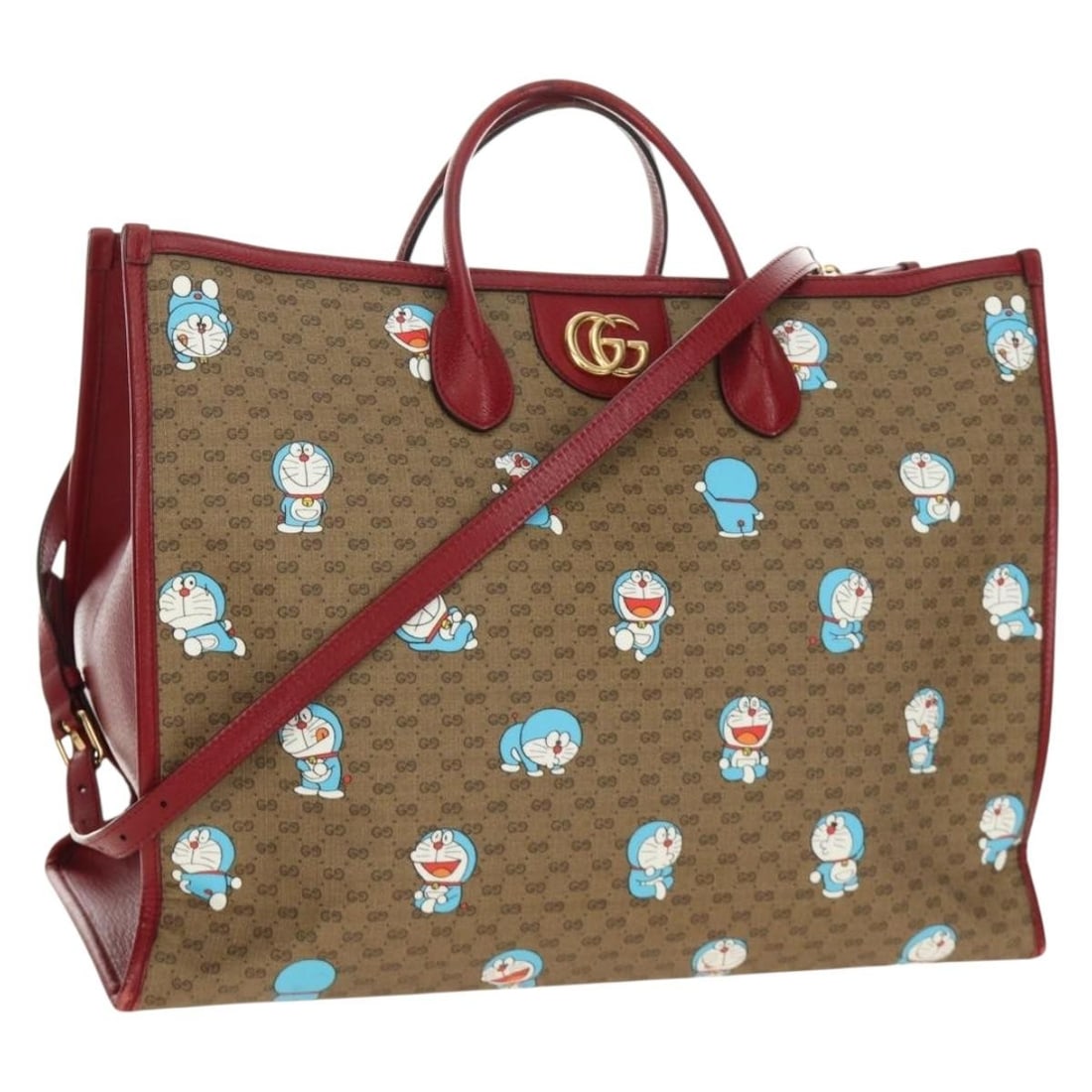 Gucci Doraemon 653952 2way Tote Bag Beige Micro GG Supreme PVC: Gucci Doraemon 653952 2way Tote Bag Beige Micro GG Supreme PVC Gucci x Doraemon Micro GG Supreme tote bag in beige and gold, made in Italy from PVC leather and Micro Small GG Canvas. This 2-way bag co