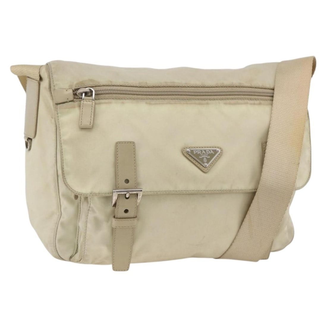 PRADA Beige Nylon Shoulder Bag with Guarantee Card Italy: PRADA Beige Nylon Shoulder Bag with Guarantee Card Italy This PRADA shoulder bag features a beige and silver nylon exterior, offering a stylish and practical accessory for everyday use. Designed for w